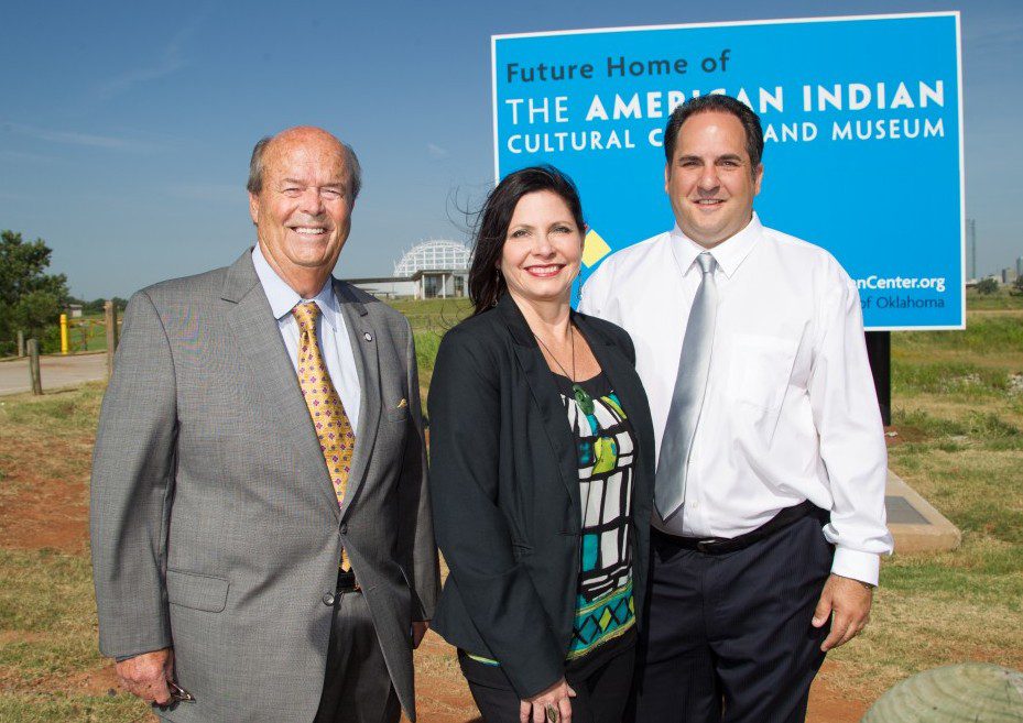 J. Blake Wade, executive director of AICCM; Shoshana Wasserman, director of communications and cultural tourism; and Sen. Kyle Loveless R-Oklahoma City) stand at the partially finished site of the American Indian Cultural Center and Museum.
