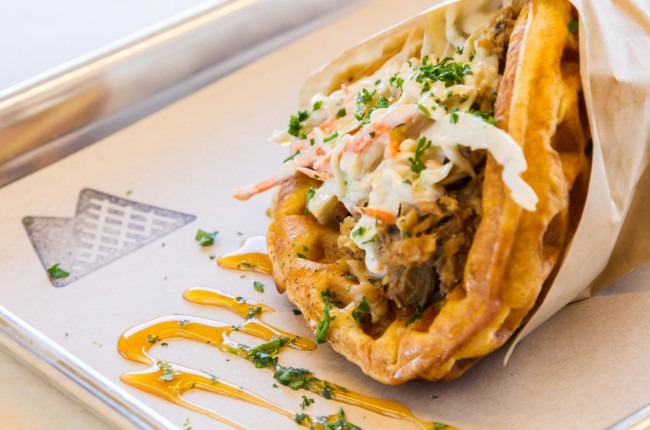 The pulled pork waffle is served with Maytag bleu cheese slaw and Tobasco honey sauce. Photo by J. Christopher Little.
