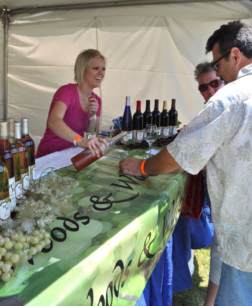 A representative of Woods & Waters Winery and Vineyard in Anadarko pours wine samples at last year’s Made in Oklahoma Wine, Beer and Food Festival. Photo courtesy Midwest City Convention & Visitors Bureau.
