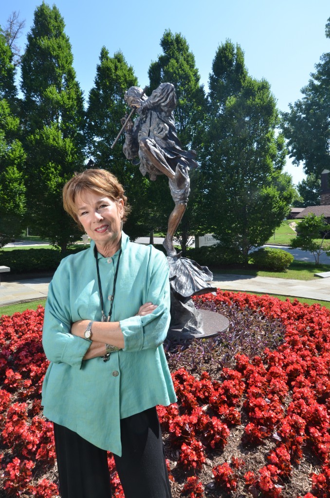 Sculptor Rosalind Cook is pictured with her piece titled Celebrating the Arts, installed in 1990 displayed at Harwelden Mansion. Photo by Dan Morgan.