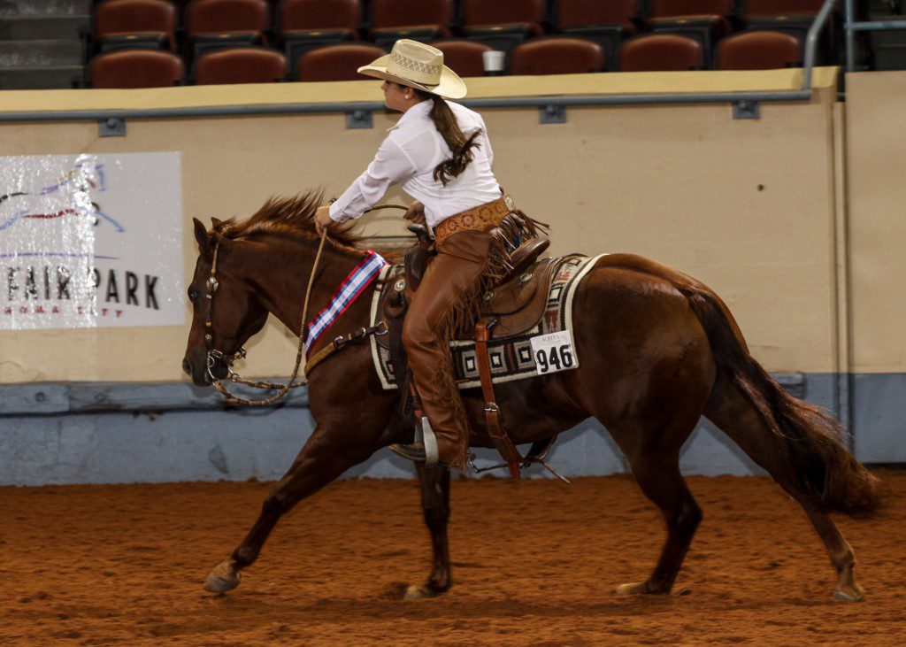 Shelby Reine of La Place, La., and rides Topsail Oak in the AQHYA World Championship Show in 2013. Photo by and courtesy of The American Quarter Horse Journal.