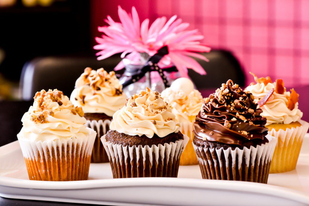 Sheila Hulsman offers up to 20 cupcake flavors – including Bringing Home the Bacon, Snow White’s Delight, Slow Poke, Sin Is In, Peanut Butter Surprise and 24-Carrot Baby – at her bakery, Not Your Grandma’s Cupcakes. Photo by Natalie Green.