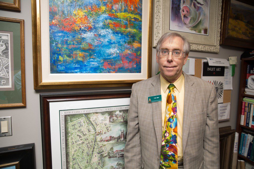 Tom Rink can always find more room to hang his growing art collection in his tulsa apartment. Photo by Brandon Scott.