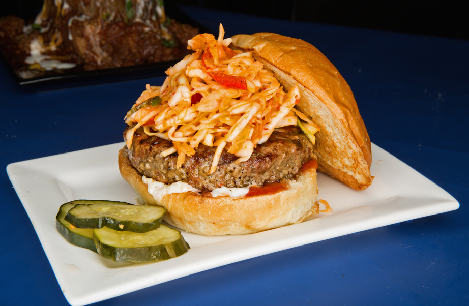 The Kimmi is a hoison-basted patty topped with housemade kimchi slaw, cilantro-lime crème and spicy ketchup at Brownies Gourmet Burgers. Photo by Brandon Scott.