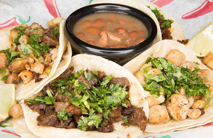 Street tacos are served with charro beans at Z’s Taco Shop & Market. Photo by Brandon Scott.