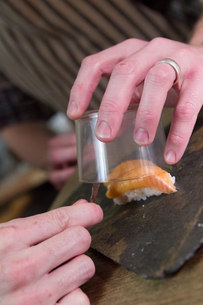 A Nani chef smokes a piece of sushi. Photos by Brent Fuchs.