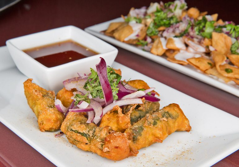 Flavorful chicken spinach rolls at cumin honor the tradition of indian cooking techniques and dishes straight from the home kitchen. Photo by Brandon Scott.