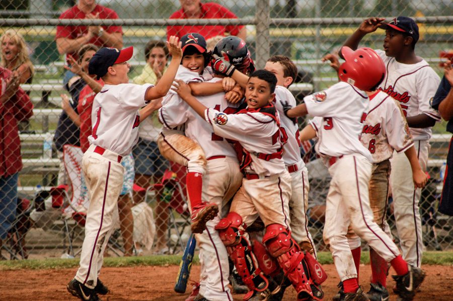 The Gulf Coast Cardinals celebrate a victory, Lake Jackson, Texas, 2009. Photo by Brenda Read Photography.
