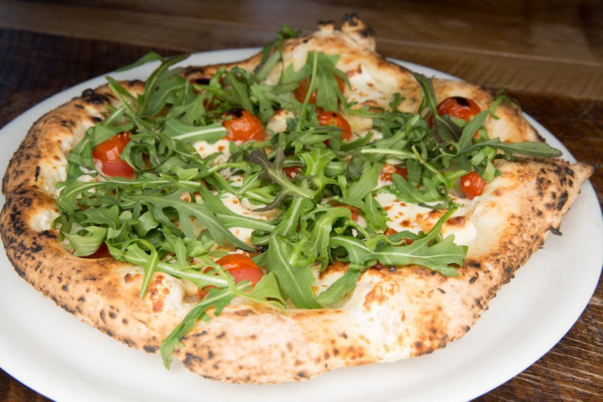 The Scamorza features cherry tomatoes, smoked mozzarella and arugula. Photos by Brandon Scott.