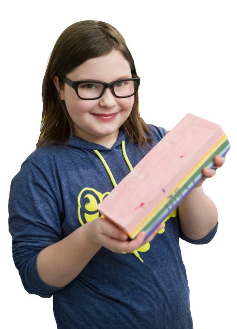 The Little Bubble owner, 10-year old Bella Corrente, holds up one of her popular soaps – Unicorn Farts. Photo by Brent Fuchs.