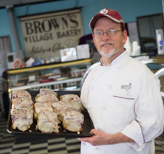William Brown shows off some of Brown bakery’s famous cinnamon rolls that come covered in just the right amount of icing. Photos by Brent Fuchs.