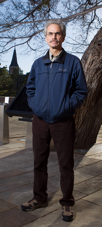 Dennis Purifoy, who survived the blast, stands next to the Survivor Tree, located on the grounds of the Oklahoma City National Memorial & Museum.