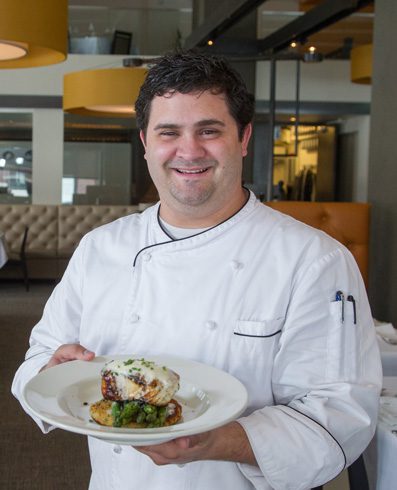 Head Chef John Patterson holds the sea bass buerre blanc.