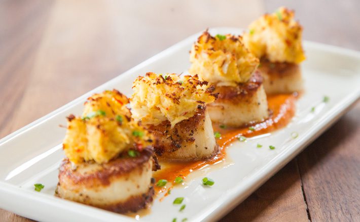 Stuffed scallops with red pepper coulis is among the seafood selections at Broadway 10. Photos by Brent Fuchs.