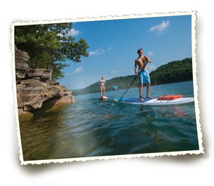 Visitors of Beaver Lake enjoy a day on the water with paddleboards.  Photo courtesy Arkansas department of Parks and tourism.