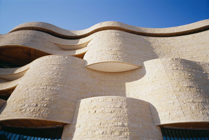 The National Museum of the American Indian has a curvilinear architecture.  Photo courtesy Smithsonian National Museum of the American Indian. 