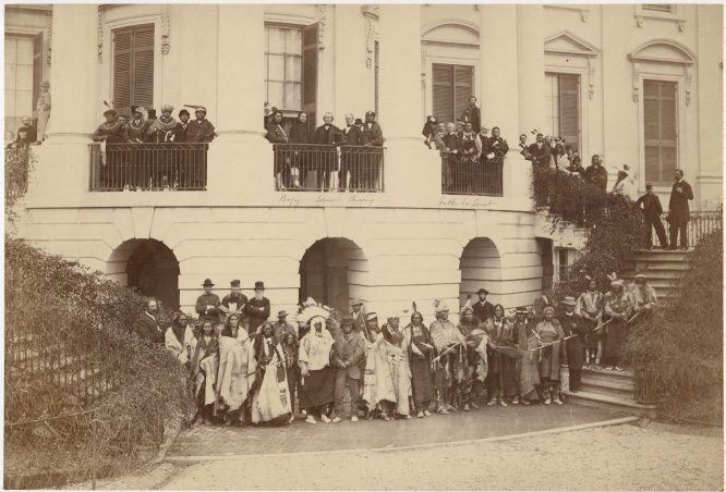 Delegation posing with President Andrew Johnson on the steps of the White House, 1867. Representatives of the Yankton, Santee, Upper Missouri Sioux, Sac and Fox, Ojibwa, Ottawa, Kickapoo and Miami Nations. Photo by Alexander Gardner.