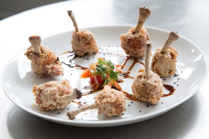 The Chicken Lollipops, chicken wings brined to tenderness  and then cooked, are a signature appetizer of Guernsey Park. Photo by Brent Fuchs.