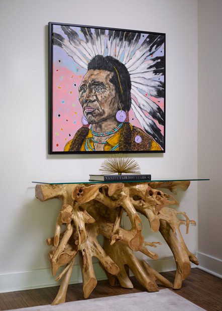 A Ryan Cummingham painting adds a pop of color to the living room.