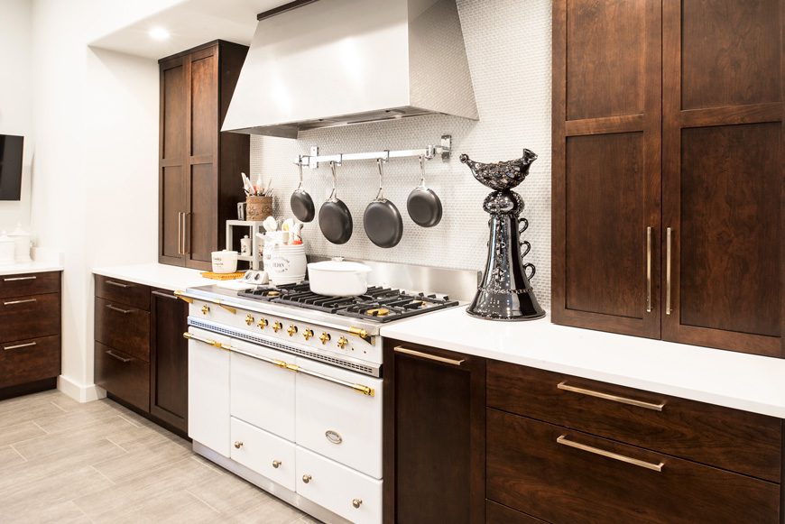 The Lacanche range was manufactured in France and is identical to one that was in the owner’s previous home. The counter-to-ceiling cabinets flanking the stove are the only upper cabinetry in the room, designed by Kitchen Ideas. Photo by Melissa Lukenbaugh.