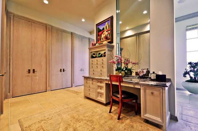 Custom his-and-her vanities provide private space and storage.
