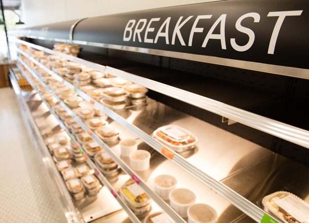 Refrigerated cases hold prepared entrees and sides for breakfast, lunch and dinner. Photo by Brent Fuchs