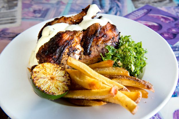 Trencher’s Peruvian chicken is served with spicy mayonnaise, crispy fries and kale salad. Photo by Natalie Green.