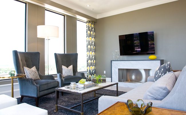 The focal point of the living room, the eco-friendly fireplace was custom-designed for the condo and faced in marble.