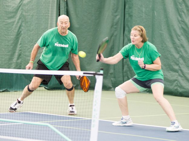 Couple enjoys a game of pickleball. Photo by Brent Fuchs.