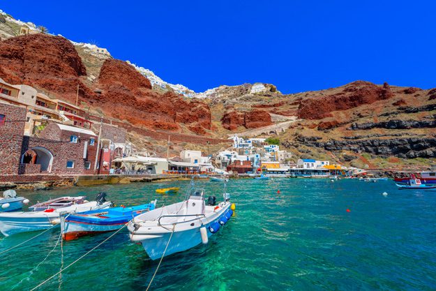 Fishing boats are gathered in the fishing village of Cyclades on Santorini.