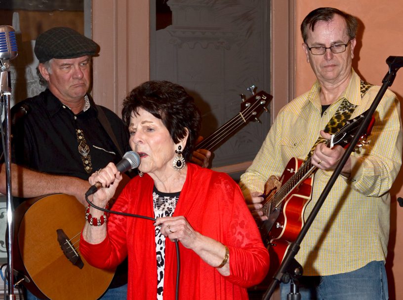 Ramona Reed performs with her son Jim Paul Blair (right). Also pictured is band member Bill Morgan. Photo by Dan Morgan.