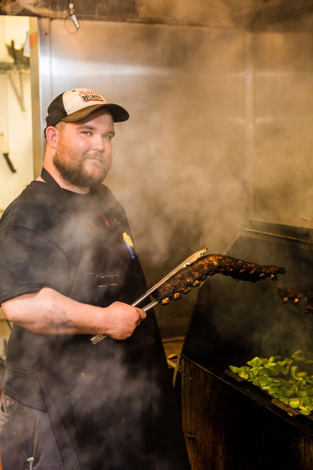 Nick Corcoran, pit master at burn co. Barbeque. Photo by Chris Humphrey Photographer.