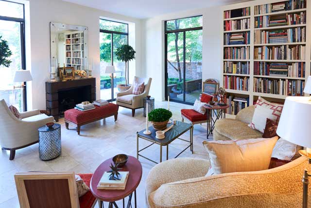 The living room is a seamless blend of traditional antiques and contemporary furnishings.