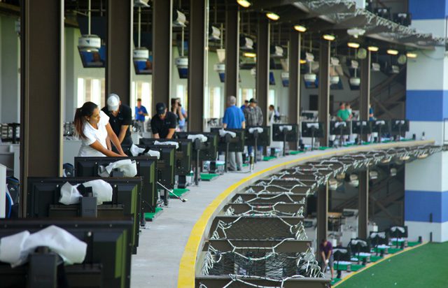 Visitors to the Flyingtee practice their golf game in the state-of-the-art building located inside the Jenks Riverwalk. Photos by Marc Rains.