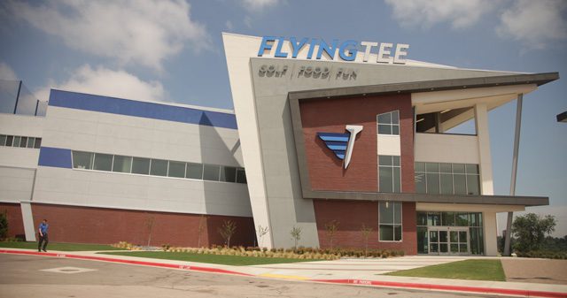 Visitors to the flyingtee practice their golf game in the state-of-the-art building located inside the jenks riverwalk. Photos by Marc Rains.