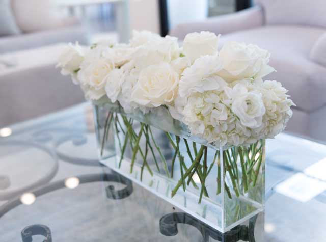 A quiet and calming style element, the “tone-on-tone” trend won’t go out of style due to its sleek and timeless nature. Photo by Nathan Harmon. Flower arrangement by Toni’s Flowers & Gifts.