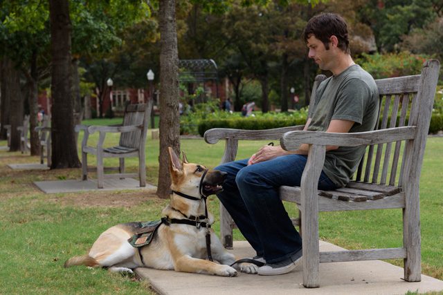 Ruby helps Ryan Perkins deal with the large crowds at The University of Oklahoma. Photo by Riven Dell.