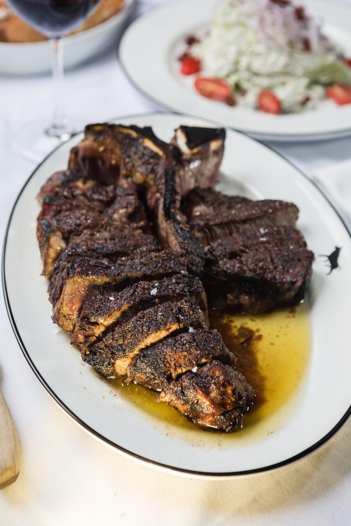 an elegant, secretive watering hole and steakhouse in tulsa offers delicious USDA prime porterhouse steak. Photo by Chris Humphrey Photographer