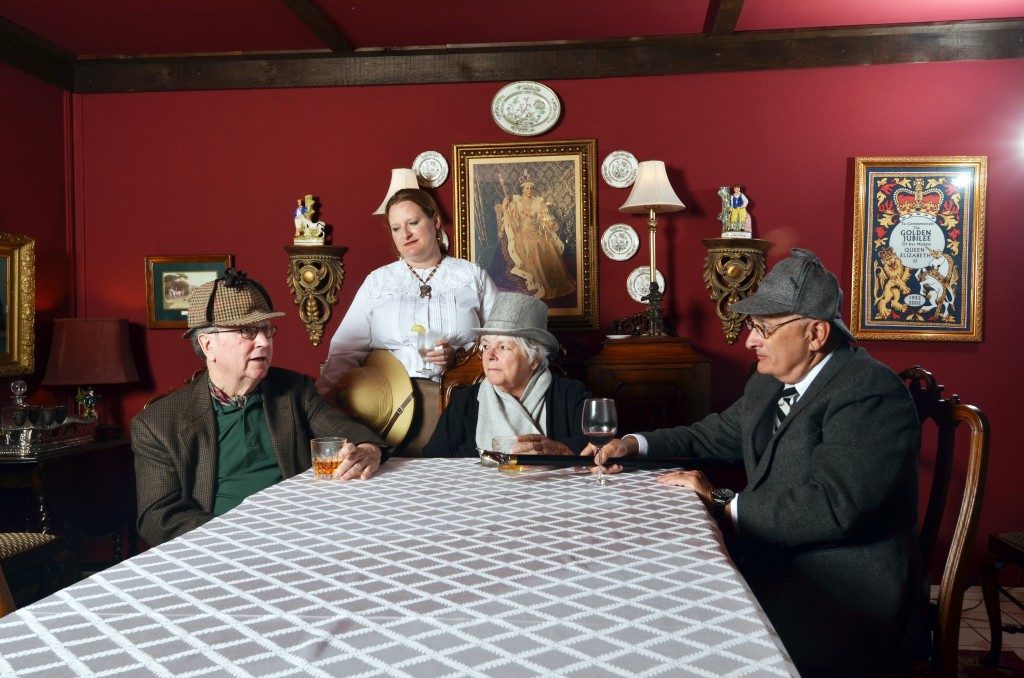 Dean Clark, Brandi Blankenship, Rosalie Mollica and Richard Kearns discuss Sherlock Holmes in the Parliament Room at the White Lion pub, where the Afghanistan Perceivers meet each month. Photo by Dan Morgan