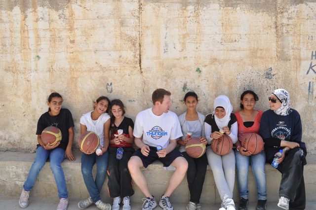 Sam Presti with a group of Palestinian girls with whom he worked as part of PeacePlayers International. Photo courtesy of the Oklahoma City Thunder.