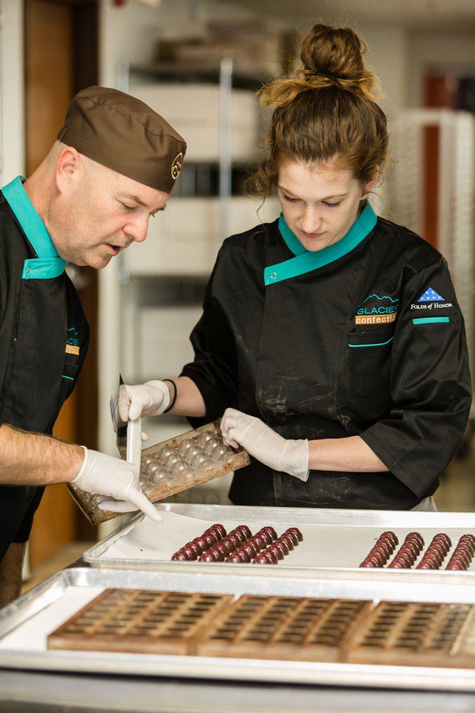 Bill Copeland and Hannah Schriever inspect the company’s creations. Photo by Chris Humphrey Photographer.