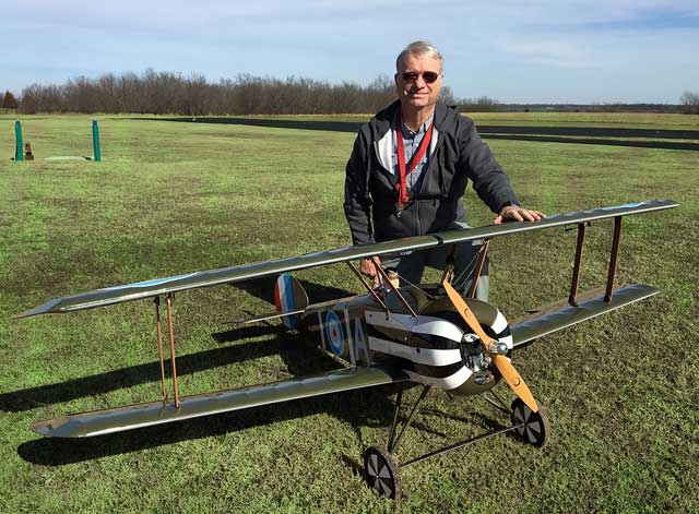 Retired teacher and coach Doug Bromley of the Tulsa Glue Dobbers readies his plane, the Sopwith Camel. Photo courtesy Mike Pennell.