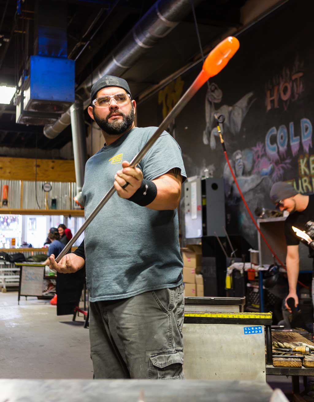 Kenneth Gonzalez learned glassblowing in college and now works to teach the art to students in Tulsa. Photo by Chris Humphrey Photographer.