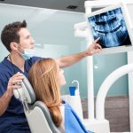 The dentist and the patient commenting about medical treatment