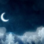 Night picture with bright moon above clouds at starry sky.