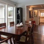 Directly adjacent to the kitchen is the dining area which seats six.