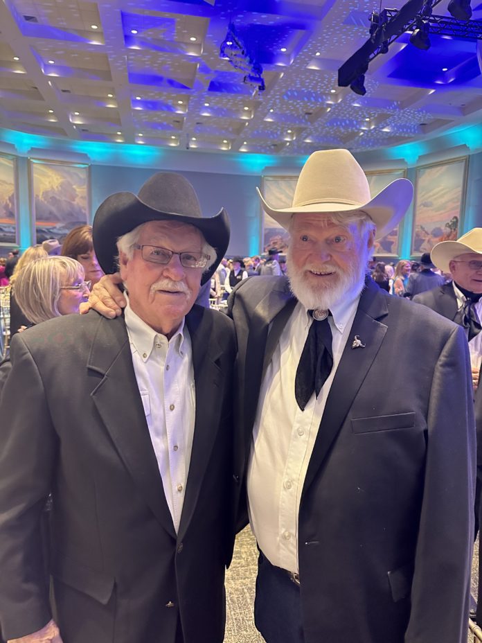 Ray Bingham (left) poses with longtime friend and client, cowboy music star Red Steagall. Photo courtesy Brett Bingham